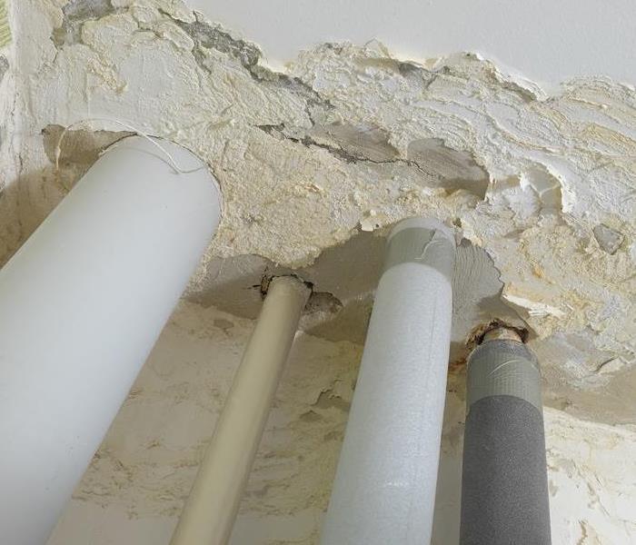 drywall damage around pipe